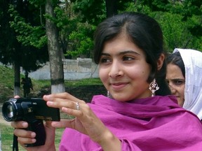 Malala Yousufzai, a 14-year-old schoolgirl who was wounded in a gun attack, is seen in Swat Valley, northwest Pakistan, in this undated file photo. (REUTERS/Hazart Ali Bacha files)