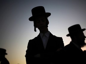 Ultra-Orthodox Jewish men take part in the Tashlich ritual near the shore of the Mediterranean Sea in the southern city of Ashdod September 24, 2012. (REUTERS/Amir Cohen)