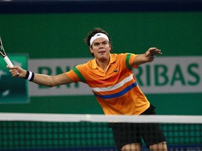 Canada's Milos Raonic returns the ball to Australia's Marinko Matosevic during the men's singles match at the Shanghai Masters tennis tournament in Shanghai October 9, 2012. (REUTERS/Aly Song)