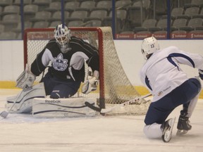 Nazem Kadri fires a shot at goalie Mark Owuya during Friday’s Toronto Marlies practice at Ricoh Coliseum. The Marlies open their AHL season at home versus Rochester Saturday at 5 p.m. (Jack Boland/QMI Agency)