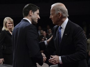 U.S. Republican vice-presidential candidate Paul Ryan (left) and vice-president Joe Biden shake hands after the vice-presidential debate at Centre College in Danville, Kentucky, on Wednesday. (Michael Reynolds/AFP)