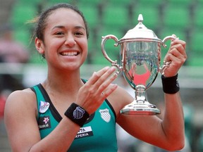Heather Watson of Britain holds the trophy after winning the Japan Women's Open tennis tournament in Osaka on October 14, 2012. Watson defeated Chang Kai-chen of Taiwan in the final 7-5, 5-7, 7-6 (7/4) and became the first Briton in 24 years to win a WTA title.    JAPAN OUT      AFP PHOTO / JIJI PRESS