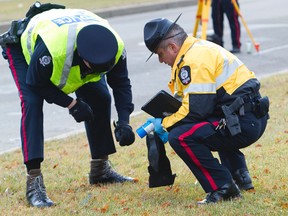 Police investigate after a teenage pedestrian was killed in a hit and run on 82 Street at 141 Avenue in Edmonton, Alberta on Sunday, October 14, 2012.  AMBER BRACKEN/EDMONTON SUN/QMI AGENCY