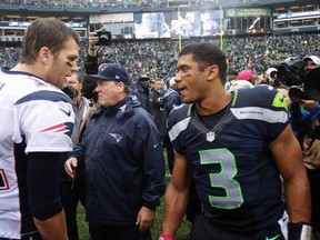Patriots QB Tom Brady talks with Seattle's Russell Wilson after Sunday's game. (REUTERS)