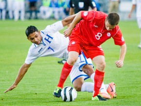 Canadian Will Johnson and Honduras’ Emilio Izaguirre battle for the ball during their game at BMO Field earlier this year. (ERNEST DOROSZUK/Toronto Sun)