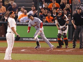 St. Louis Cardinals' Carlos Beltran (3) watches his fourth inning two-run home run along with home plate umpire Chris Guccione (R), San Francisco Giants catcher Buster Posey and starting pitcher Shelby Miller (L) during Game 1 of their MLB NLCS playoff baseball series in San Francisco, October 14, 2012. (REUTERS/Danny Moloshok)