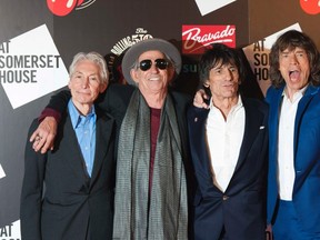 The Rolling Stones (L-R) Charlie Watts, Keith Richards, Ronnie Wood and Mick Jagger pose as they arrive for the opening of the exhibition "Rolling Stones: 50" at Somerset House in London July 12, 2012. REUTERS/Ki Price