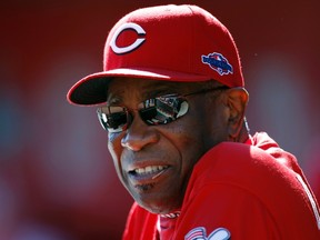 Cincinnati Reds manager Dusty Baker watches from the dugout as his team plays the San Francisco Giants in Game 5 of their MLB NLDS playoff baseball series in Cincinnati, Ohio October 11, 2012. (Reuters/JEFF HAYNES)
