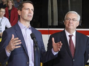 Local MPP and Attorney General John Gerretsen looks on as Premier Dalton McGuinty speaks during a visit to the Bombardier plant in Millhaven in 2012. The premier announced his resignation as an MPP Wednesday, a move that surprised Gerretsen.