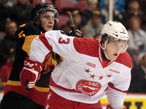 Soo Greyhounds vs. Belleville Bulls at Essar Centre in Sault Ste. Marie, Ont. on Thursday October 18, 2012. Bulls Jason Shaw (5) gives a push to Soo Greyhound Tyler Ganly (5) in the first period. Final score not yet available.RACHELE LABRECQUE/SAULT STAR/QMI AGENCY