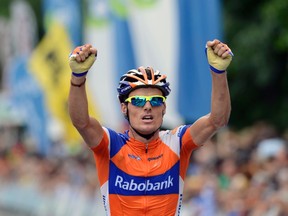 Rabobank rider Luis Leon Sanchez of Spain raises his arms in victory as he crosses the finish line to win the Clasica San Sebastian cycling race in San Sebastian August 14, 2012. (REUTERS/Vincent West)