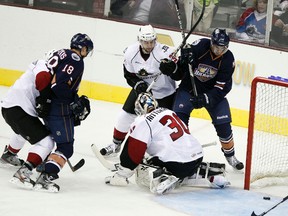 CLEVELAND, OH - OCTOBER 12: Ryan Nugent-Hopkins #18 of the Oklahoma City Barons gets the puck past goalie Sami Aittokallio #30 of the Lake Erie Monsters, but does not score during their game on October 12, 2012 at Quicken Loans Arena in Cleveland, Ohio. The Monsters defeated the Barons 2-1.   David Maxwell/Getty Images/AFP