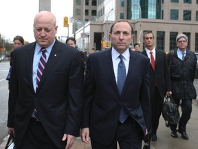 NHL commissioner Gary Bettman and deputy commissioner Dill Daly walk away from league meetings in Toronto Thursday. (QMI Agency)