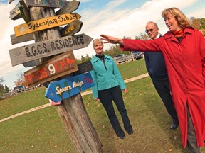 Former Ontario Education Minister Laurel Broten on Oct. 19, 2012 admires the school signpost during a tour of the Bluewater Outdoor Education Centre located near Oliphant as Bluewater Education Foundation directors Ann McKay and Ron Mottram look on. Willy Waterton\The Sun Times.