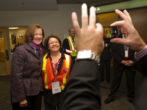 Premier Alison Redford poses for a photo with an AUPE member after speaking at the 36th AUPE annual convention, making her the first premier to do so, at the Shaw Conference Centre in Edmonton, Alberta on Saturday.  AMBER BRACKEN/EDMONTON SUN/QMI AGENCY