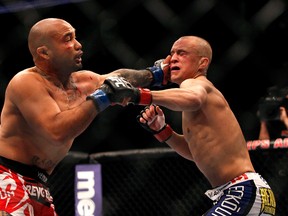 Featherweight Mark Hominick (right), who is on a three-fight losing skid, dropped an entertaining split decision to Eddie Yagin at UFC 145, his last time out. (AFP)