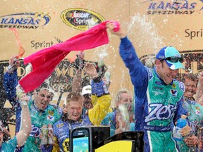 Matt Kenseth celebrates after winning the NASCAR Sprint Cup Series Hollywood Casino 400 at Kansas Speedway in Kansas City on Sunday. (GETTY IMAGES)