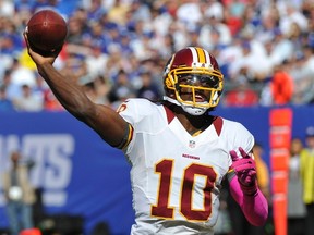 Redskins quarterback Robert Griffin III throws a pass against the Giants during NFL action in East Rutherford, N.J., on Sunday, Oct. 21, 2012. (Ray Stubblebine/Reuters)