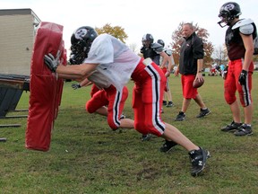 Members of the Northern Vikings junior boys football team work against the blocking sled during practice on Monday. PAUL OWEN/THE OBSERVER/QMI AGENCY