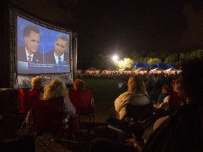 The crowd watch Republican presidential nominee Mitt Romney and U.S. President Barack Obama meet in the final U.S. presidential debate in Boca Raton, Florida, October 22, 2012. (Reuters/ANDREW INNERARITY)