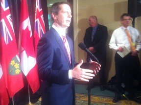 Premier Dalton McGuinty scrums with reporters Wednesday, Oct. 24, 2012, for the first time since announcing his retirement. (JONATHAN JENKINS/Toronto Sun)