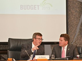 Jim Watson, left, and Coun. Steve Desroches share some words during the 2012-13 draft operating budget tabling meeting at Ottawa City Hall on Wednesday.(Matthew Usherwood/Ottawa Sun)