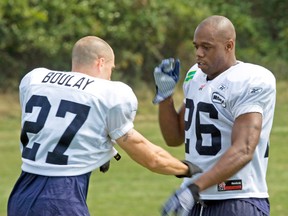 Argos’ Jordan Younger, swatting away the hand of fellow safety Etienne Boulay at practice, says he believes his team is well aware of its playoff situation. (Toronto Sun files)