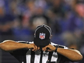 An NFL referee rubs his eyes before the Cleveland Browns play the Baltimore Ravens during their NFL football game in Baltimore, Maryland, September 27, 2012. (REUTERS/Patrick Smith)