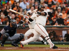 Pablo Sandoval hits the first of three home runs for the Giants against the Tigers during Game 1 of the World Series in San Francisco on Wednesday, Oct. 24, 2012. (Lucy Nicholson/Reuters)