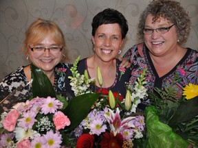 Theresa Bell, centre, won the Remarkable Woman of Quinte award in 2013. Here she is flanked by 2013 runners-up, Sandie Sidsworth and Karen Baker. 
Nominations are now open for this year's award. 
Intelligencer file photo.
