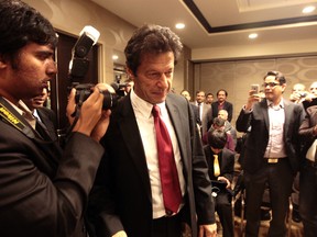 Cricket star turned politician Imran Khan speaks to supporters in Brampton on Thursday night. (DAVE ABEL/Toronto Sun)