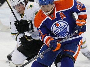 Ales Hemsky battles for a puck with Dallas Stars forward Loui Eriksson during a game at Rexall Place on March 28. The locked out Edmonton Oilers player has been lighting it overseas, recording 14 points in 13 games with CSOB Pojistova Pardubice in the Czech Extraliga.
Perry Nelson/Edmonton Sun