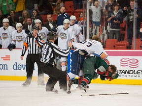 Defenceman Colten Teubert manhandles right winger Brett Bulmer during Friday night's Houston Aeros' 6-4 win over the Oklahoma City Barons at the Cox Center.
Rob Ferguson, OKC Barons