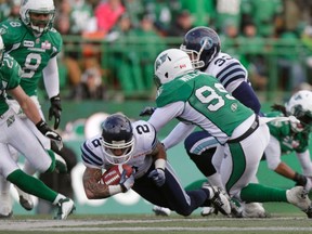 Argos' Chad Owens dives for extra yardage against the Saskatchewan Roughriders in Regina on Saturday. The Argos' 31-26 win clinches a playoff berth for the Boatmen. (Reuters)