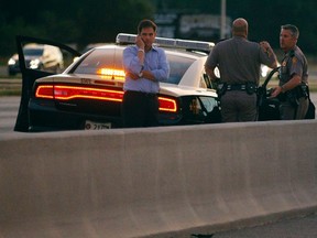 U.S. Senator Marco Rubio stands on the side of Interstate 4, where the motorcade carrying U.S. Republican presidential nominee Mitt Romney stopped, in Lakewood Crest, Florida October 27, 2012. REUTERS/Brian Snyder