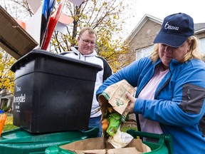 Ottawa councillor for River Ward Maria McRae and her husband Paul put their recycling to the curb.  (Errol McGihon/Ottawa Sun/QMI Agency)