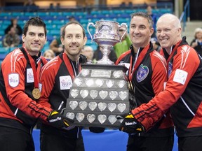 Ontario skip Glenn Howard, Wayne Middaugh (2nd R), Brent Liang (2nd L) and Craig Saville (L) hold the Brier Trophy after winning the gold medal game against Alberta at the Canadian Men's Curling Championships in Saskatoon, Saskatchewan March 11, 2012. (REUTERS)
