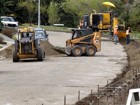 City crews do infrastructure work in Capilano recently. Several older Edmonton neighbourhoods have had such work done, and more is planned. (TOM BRAID/Edmonton Sun)