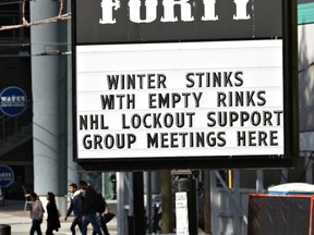 A pub near the home arena of the NHL Vancouver Canucks posts a sign in regarding h current league and players dispute in Vancouver, October 1, 2012. NHL has already cancelled its entire pre-season schedule and the regular-season schedule for November with the Jan. 1, 2013 Winter Classic also in doubt. (ANDY CLARK/Reuters file photo)