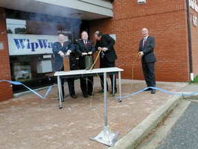 MPP Vic Fedeli, left, MP Jay Aspin, North Bay Mayor Al McDonald and Tom Palangio, president and founder of WipWare Inc., avoided the traditional ribbon cutting in this file photo by blowing one up to mark the second expansion in a year for the mining software and equipment company. The company has been receiving positive reviews for its enhanced software used to predict rock fragmentation.