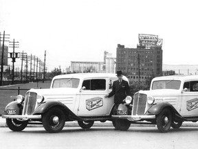 Mother Parker’s fleet of delivery trucks, above, parked on lower Bay St., 1939. Note the Toronto Harbour Commission Building to the extreme right of the view. Across the background are the now demolished Maple Leaf Mills elevators, the Yardley Building (on York St.) and the towering chimneys of the plant that supplied steam heat to Union Station, the main Post Office and the Royal York Hotel.