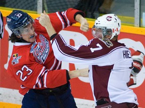 Peterborough Petes' Luke Hietkamp, right, trades punches with Oshawa Generals' Scott Sabourin during period  OHL action on Nov. 1 at the Memorial Centre in Peterborough. (CLIFFORD SKARSTEDT/QMI AGENCY)