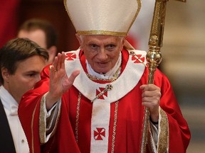 Pope Benedict XVI waves during a mass, to commemorate the cardinals and bishops who died this year, in St. Peter's Basilica at the Vatican Nov. 3, 2012. REUTERS/Tony Gentile