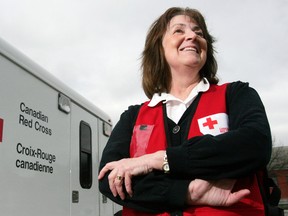 Red Cross volunteer Joy Martin of Belleville, Ont. stands with one of the agency's emergency response vehicles in Belleville prior to deploying to storm-ravaged New Jersey Saturday, Nov. 3, 2012 in Belleville, Ont. Martin is one of 10 Canadian Red Cross volunteers heading to the northeastern United States to help victims of Hurricane Sandy. Luke Hendry/QMI Agency
FOR PAGINATORS:
"What we're bringing is hope," said Martin, who was part of relief missions during the war in Kosovo, Hurricane Katrina and the 2001 terrorist attack on New York City.
