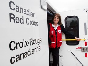 Red Cross volunteer Joy Martin of Belleville, Ont. stands inside one of the agency's emergency response vehicles in Belleville prior to deploying to storm-ravaged New Jersey Saturday, Nov. 3, 2012 in Belleville, Ont. Martin is one of 10 Canadian Red Cross volunteers heading to the northeastern United States to help victims of Hurricane Sandy. Luke Hendry/QMI Agency
FOR PAGINATORS:
"What we're bringing is hope," said Martin, who was part of relief missions during the war in Kosovo, Hurricane Katrina and the 2001 terrorist attack on New York City.