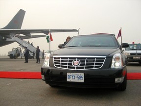 An RCMP officer watches over the armoured Cadillac limousine shipped by the RCMP to India on Nov. 5, 2012. Normally, host countries provide secure vehicles for the PM when he travels but, in India this week, the RCMP decided to bring ship vehicles from Canada to ferry Prime Minster Stephen Harper and his wife Laureen around Agra, New Delhi, Chandrigarh and Bangalore. (DAVID AKIN/QMI Agency)