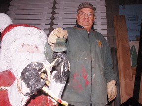 Volunteer Keith Earle paints one of the Simcoe Christmas Panorama displays. The annual show of lights and displays gets underway this year on Dec. 1 with a ceremony in Wellington Park. (DANIEL R. PEARCE Simcoe Reformer)