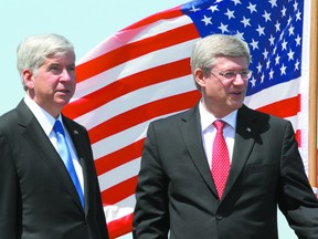 Michigan Gov. Rick Snyder and Prime Minister Stephen Harper discuss the agreement between Canada and Michigan to build the Detroit River International Crossing in Windsor on June 15, 2012. (JOEL BOYCE/QMI AGENCY)