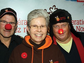 Operation Red Nose coordinator Susan Christie is joined by Fort Saskatchewan fire chief James Clark and Fort Saskatchewan Rotary Club member Stew Hennig as the group kicks off its sixth annual campaign to get drinking drivers safely home this Christmas season. Rick Volman/Record Staff