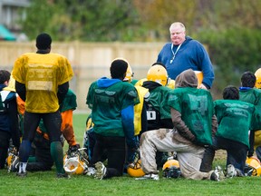Mayor Rob Ford coaches football at Don Bosco Catholic Secondary School in Toronto on Tuesday, Nov. 6, 2012. (Ernest Doroszuk/Toronto Sun)
